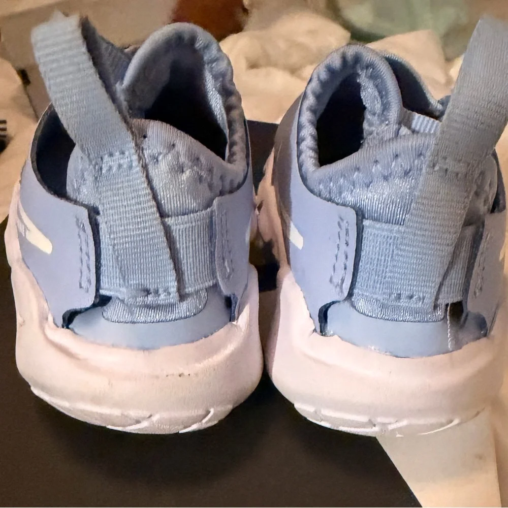 Nike Light Blue Slip-On Sneakers with White Swoosh